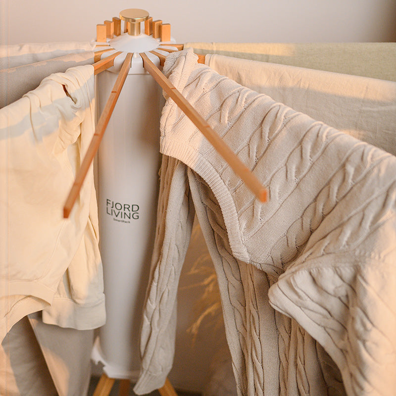 SmartRack drying rack with everyday clothes – T-shirts and jumpers on the arms