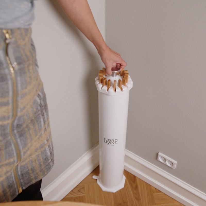 SmartRack drying rack in the corner of a living room – fits even small spaces